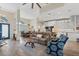 Open-concept living room featuring a dining area, modern kitchen, and cozy seating area with stylish furnishings and ample natural light at 1091 Rotonda Cir, Rotonda West, FL 33947
