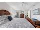 Bright main bedroom with a tray ceiling, comfortable seating area, and large bed for a peaceful retreat at 1091 Rotonda Cir, Rotonda West, FL 33947