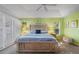 Spacious main bedroom with a trey ceiling, complemented by serene decor at 1091 Rotonda Cir, Rotonda West, FL 33947