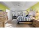 Inviting main bedroom with natural light, desk space, and carpet flooring at 1091 Rotonda Cir, Rotonda West, FL 33947