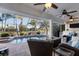 Screened lanai offers a swimming pool, spillover spa, and views of the water at 1091 Rotonda Cir, Rotonda West, FL 33947