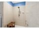 Bright tiled shower with convenient bench seating and accessible handrails at 1091 Rotonda Cir, Rotonda West, FL 33947