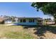 Backyard with green grass and blue skies at 1357 Nimrod St, Port Charlotte, FL 33952