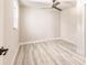 Bright bedroom featuring wood-look floors, a ceiling fan, and natural light at 1357 Nimrod St, Port Charlotte, FL 33952