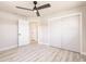 Bedroom featuring wood-look floors, a ceiling fan, and double door closet at 1357 Nimrod St, Port Charlotte, FL 33952