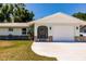 The entrance has stone accents and a charming screened-in porch that adds character to the property at 1357 Nimrod St, Port Charlotte, FL 33952