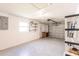 Attached garage with epoxy flooring, shelving, and a window, offering a clean and functional space at 1357 Nimrod St, Port Charlotte, FL 33952