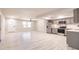 Open concept kitchen with stainless steel appliances connected to a spacious living area at 1357 Nimrod St, Port Charlotte, FL 33952