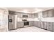 Updated kitchen featuring stainless steel appliances, gray cabinets, and subway tile backsplash at 1357 Nimrod St, Port Charlotte, FL 33952