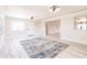 Living room with wood flooring, paneled walls, and large windows offering plenty of light at 1357 Nimrod St, Port Charlotte, FL 33952