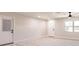 Spacious living room features two doors, recessed lights, and a large window providing natural light at 1357 Nimrod St, Port Charlotte, FL 33952