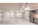 Bright and airy living room showcasing seamless flow into the updated kitchen at 1357 Nimrod St, Port Charlotte, FL 33952