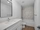 Bathroom features quartz counters, single sink and tiled tub at 1589 Boswell St, North Port, FL 34288