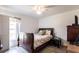Comfortable bedroom offers neutral walls and flooring with a window to allow ample natural light at 1721 Nicollett Ave, North Port, FL 34286