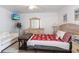Bright bedroom features a vanity mirror, side tables, and a sofa at 1721 Nicollett Ave, North Port, FL 34286