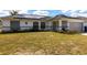 Inviting single-story home with solar panels, a well-kept lawn and a convenient two-car garage at 1721 Nicollett Ave, North Port, FL 34286