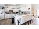 Inviting kitchen features white cabinetry, a breakfast bar and modern appliances in a clean design at 1721 Nicollett Ave, North Port, FL 34286