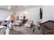 Bright living room features vaulted ceiling, light wood flooring, and comfortable seating arrangement at 1721 Nicollett Ave, North Port, FL 34286