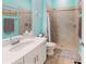 Modern bathroom features a walk-in shower, vanity, and decorative accents at 17420 Jadestone Ct, Venice, FL 34293
