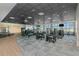 Well-equipped fitness center with modern exercise machines, ample natural light, and a spacious layout for a comfortable workout at 17420 Jadestone Ct, Venice, FL 34293