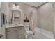Bathroom featuring tiled shower and tub, vanity, and décor at 1796 W Palms Dr, Port Charlotte, FL 33953
