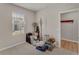 Bright bedroom with window, neutral walls, and doorway to other room at 1796 W Palms Dr, Port Charlotte, FL 33953