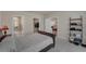 Bedroom featuring an ensuite bathroom with glass shower, walk-in closet, and access to the living room at 1796 W Palms Dr, Port Charlotte, FL 33953