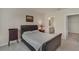 Bedroom with a leather bed, soft carpet, and ensuite bathroom in a neutral palette at 1796 W Palms Dr, Port Charlotte, FL 33953