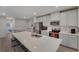 Stylish kitchen featuring a large island with seating, modern appliances, and an open layout at 1796 W Palms Dr, Port Charlotte, FL 33953