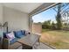 View of patio with comfortable seating and view of fenced backyard at 1796 W Palms Dr, Port Charlotte, FL 33953