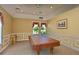 Features of the common room are visible including a pool table, and window views at 1940 Scarlett Ave, North Port, FL 34289