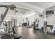 Well-equipped gym featuring modern machines, free weights, and a TV at 1940 Scarlett Ave, North Port, FL 34289