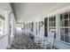 Inviting porch with rocking chairs, offering a relaxing outdoor space at 1940 Scarlett Ave, North Port, FL 34289