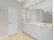 Bathroom featuring double vanity, neutral walls, and tile flooring at 2241 Boxwood St, North Port, FL 34289