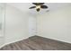 Comfortable bedroom featuring new floors, a ceiling fan, and white trim at 2241 Boxwood St, North Port, FL 34289