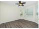 Bright bedroom with a ceiling fan and multiple windows providing ample natural light at 2241 Boxwood St, North Port, FL 34289