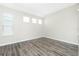 A cozy bedroom is illuminated by natural light filtering through its large windows at 2241 Boxwood St, North Port, FL 34289