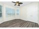 A comfortable bedroom featuring new floors, a ceiling fan, and plenty of natural light at 2241 Boxwood St, North Port, FL 34289