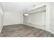 Dining Room boasting hardwood floors, natural light, and an elegant chandelier at 2241 Boxwood St, North Port, FL 34289