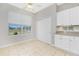Well-lit dining area features tiled floors, a window with scenic views, and ample cabinet space at 2241 Boxwood St, North Port, FL 34289