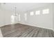 An inviting dining space is enhanced by natural light and a stylish light fixture at 2241 Boxwood St, North Port, FL 34289
