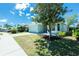 Inviting home with well-kept lawn and mature tree providing ample shade at 2241 Boxwood St, North Port, FL 34289