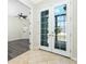 Elegant foyer with french doors, tile flooring, and an entryway with natural light at 2241 Boxwood St, North Port, FL 34289
