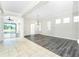 Expansive living area with a seamless transition to an outdoor pool area and modern interiors at 2241 Boxwood St, North Port, FL 34289