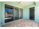 Patio with fan and views of pool, lanai, and backyard at 2241 Boxwood St, North Port, FL 34289