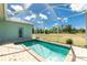 Enclosed pool with patio and clear view of sunny backyard at 2241 Boxwood St, North Port, FL 34289