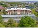 Overhead view of condo building with parking and well-maintained landscaping at 23465 Harborview Rd # 915, Punta Gorda, FL 33980