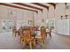 Community common area with tables, chairs, ceiling fans, and natural light at 23465 Harborview Rd # 915, Punta Gorda, FL 33980