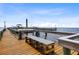 Waterfront dock with bench seating and fish cleaning station, perfect for enjoying the coastal lifestyle at 23465 Harborview Rd # 915, Punta Gorda, FL 33980