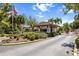 Gated entrance to the community, showcasing security and landscaping at 23465 Harborview Rd # 915, Punta Gorda, FL 33980